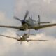 Supermarine Spitfire Mk Vb BM597 JH C G MKVB closes in on Asian Supermarine Spitfire Mk LF III PP972 G BUAR