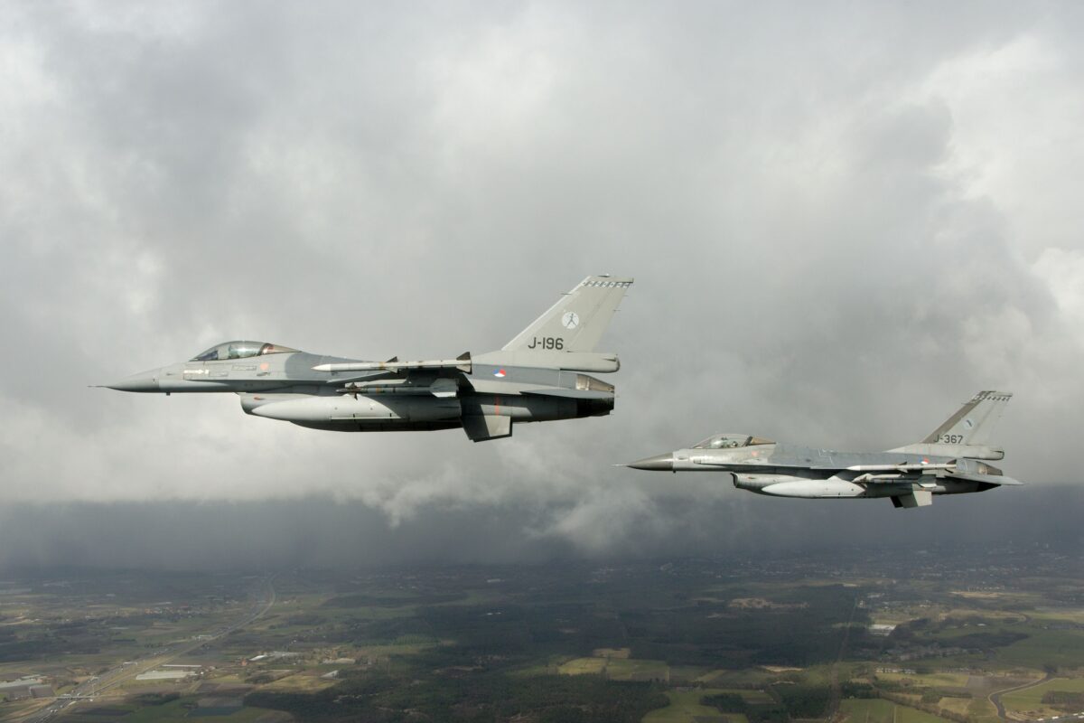 Two Dutch F-16 fighter jets flying in formation