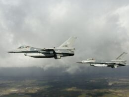 Two Dutch F-16 fighter jets flying in formation