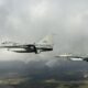 Two Dutch F-16 fighter jets flying in formation