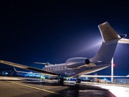 Business jet parked at night