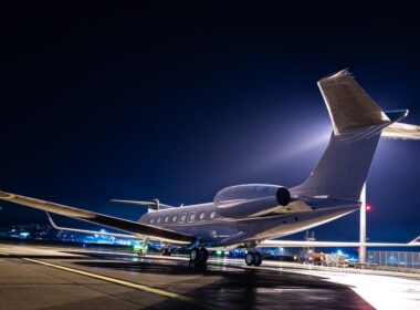 Business jet parked at night