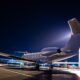 Business jet parked at night