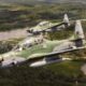 Brazilian Air Force Embraer A-29 Super Tucano aircraft in flight over the Amazon Rainforest