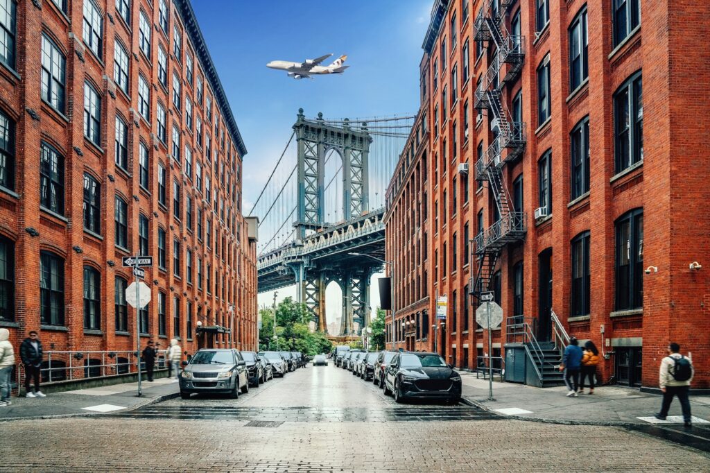 Dumbo district view in Brooklyn with Manhattan Bridge and New York City in the background