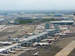 Aerial view of JFK airport terminal tower and apron