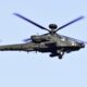 An AH-64E Apache attack helicopter