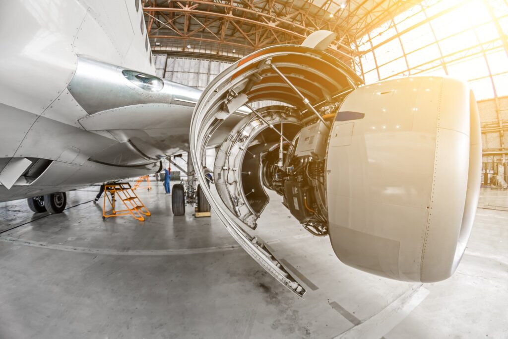 An aircraft undergoing maintenance in a hangar