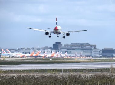 British Airways Airbus A320 landing at London Gatwick Airport LGW with multiple British Airways and easyJet aircraft in the background