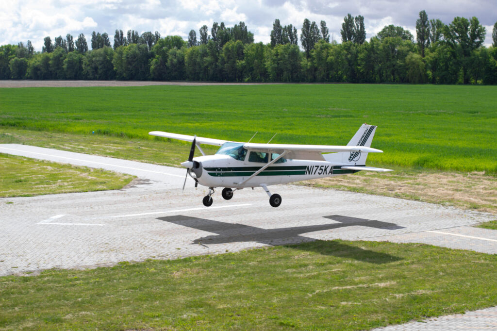 Cessna 172 is landing Small airplane in the sky student is learning how to land on the ground