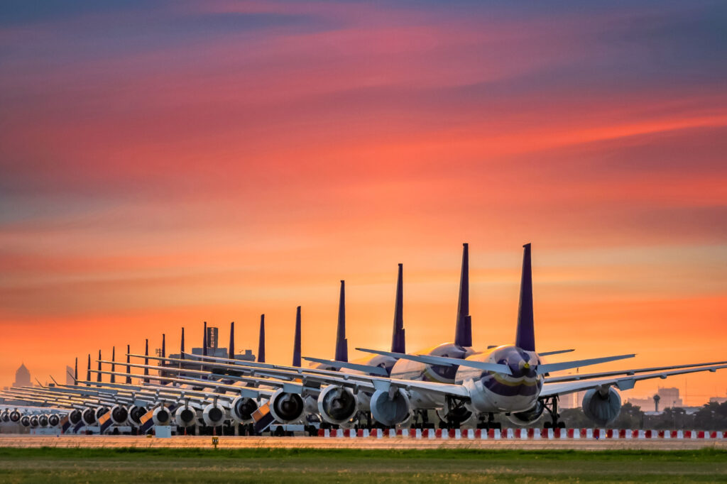 Commercial airplane parking at the airport are stopped effect by covid-19 pandemic around the world economic down crisis