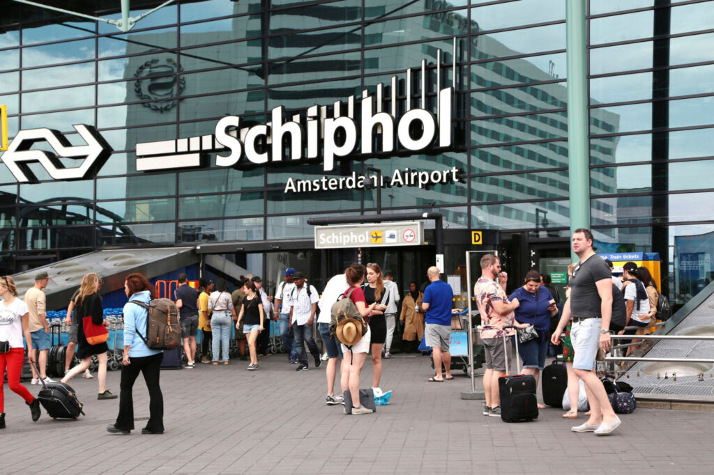 Passengers at Amsterdam Schiphol airport