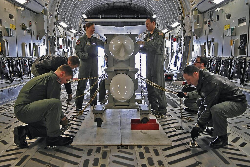 Two B61 gravity nuclear bombs being loaded into a C-17 transport aircraft