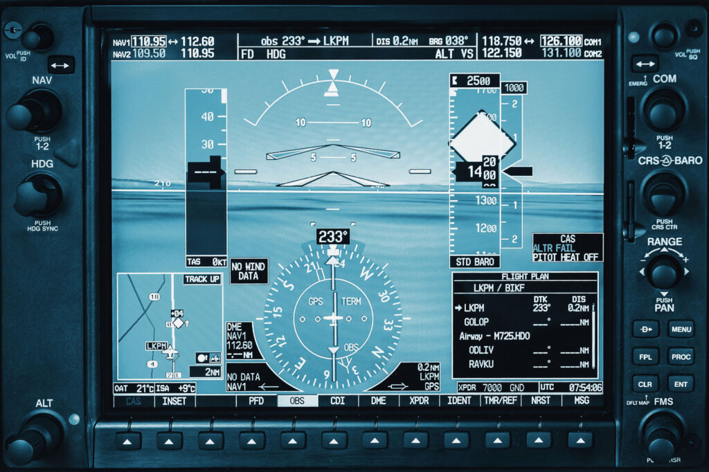 Computer in cockpit Airplane glass cockpit display with weather radar and engine gauges in small private airplane