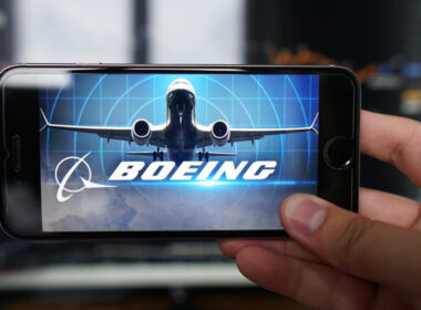 boeing_737_max_and_the_companys_logo_displayed_on_a_phone.jpg