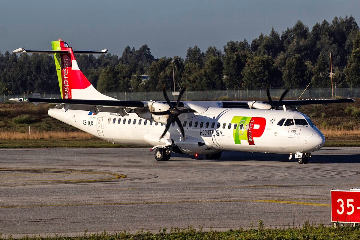 TAP Portugal Express aircraft on the runway, highlighting convenient travel options for a successful getaway in Portugal.