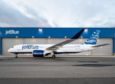 jetblue_a220_by_a_hangar.jpg