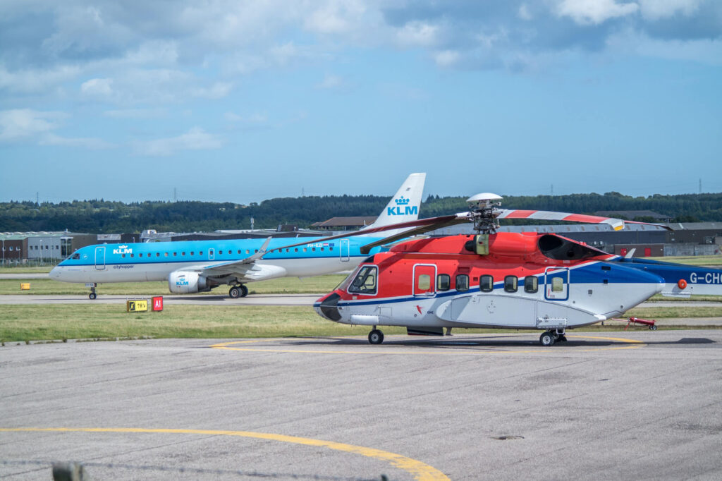 klm_plane_and_a_helicopter_at_abz_airport.jpg