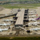 Aerial view of planes at Terminal 2 of London Heathrow Airport on a cloudy day Airlines using this terminal include Air Canada Singapore Airlines and United Airlines