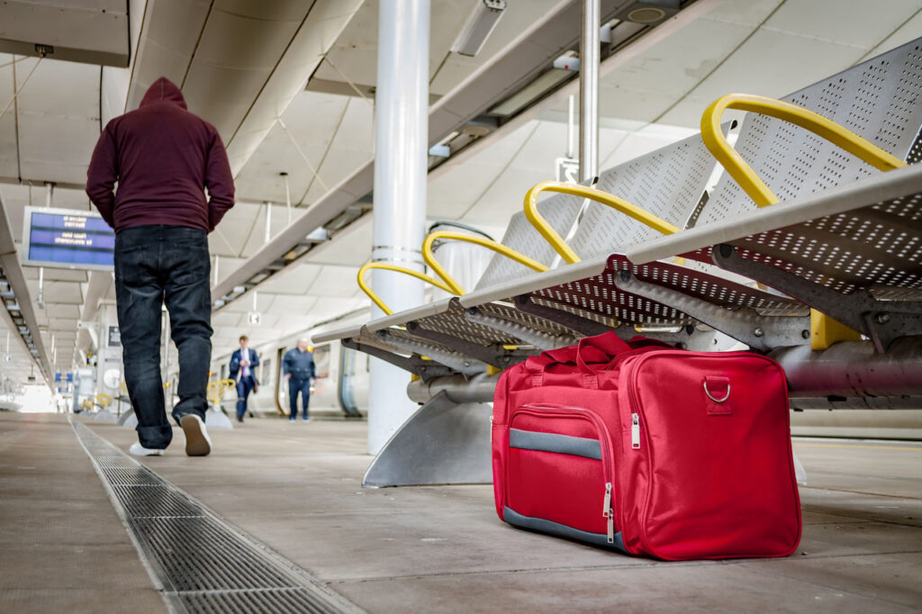 man with suspicious bag