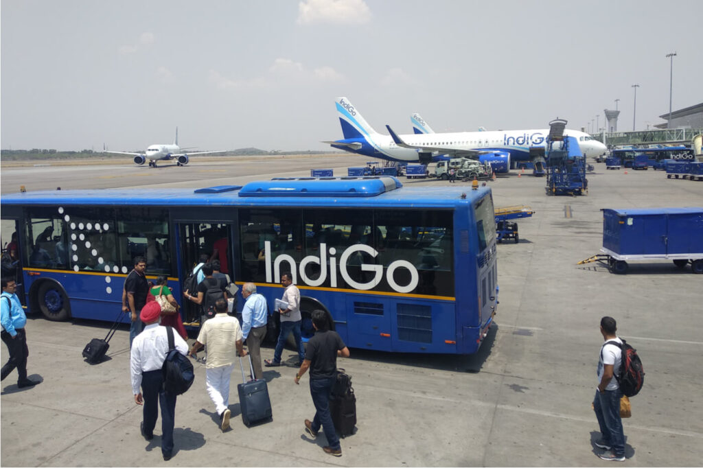 passengers_board_indigo_airline_shuttle_bus.jpg