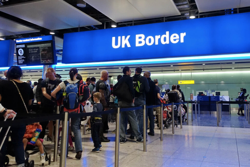 passengers_queue_at_heathrow_airport.jpg