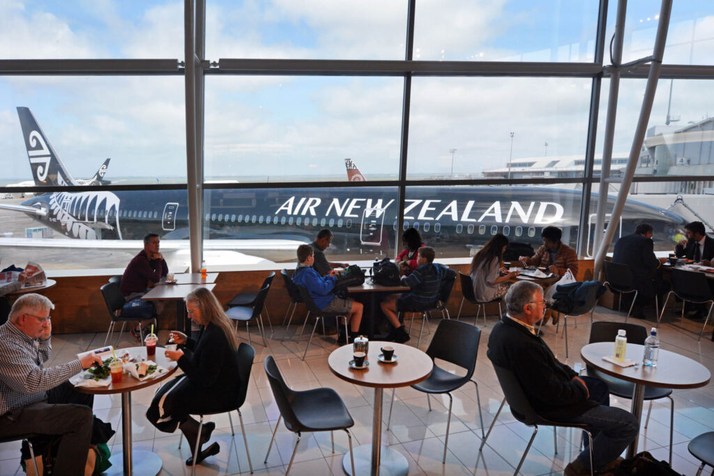 passengers_wait_to_fly_at_auckland_airport.jpg