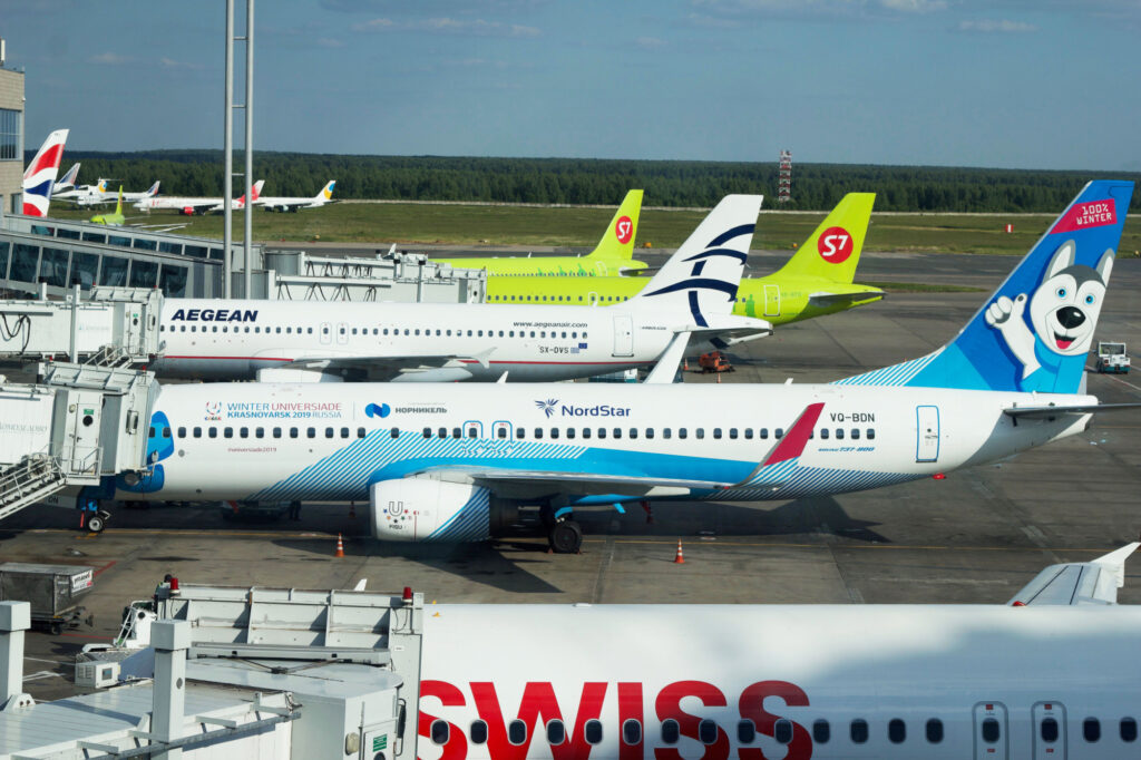 planes of different airlines are waiting for their passengers in Domodedovo airport