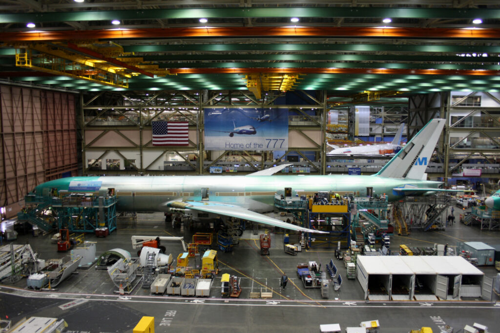 Boeing employees continue work building a Boeing 777 jets