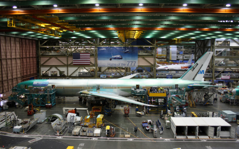 Boeing employees continue work building a Boeing 777 jets