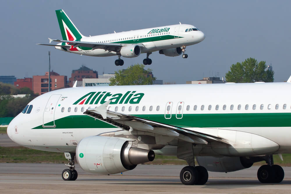 two_alitalia_airbus_a320_aircraft_in_milan_linate_airport_lin_italy.jpg