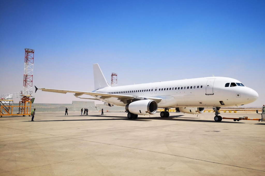 white_aircraft_in_desert_airport.jpg