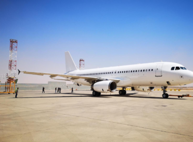 white_aircraft_in_desert_airport.jpg